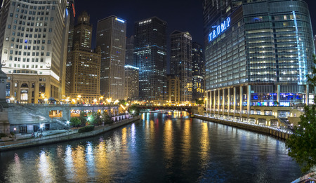 CHICAGO, USA - JUNE 4, 2016: The Chciago River runs through downtown Chicago dividing the business district on the left from the River North Gallery District on the right. Breathtaking views can especially be had at night.のeditorial素材