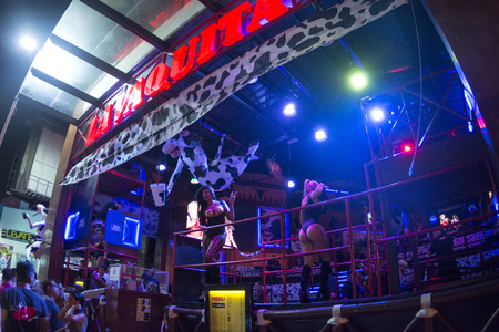 CANCUN, MEXICO - FEBRUARY 28, 2017: Go-go dancers perform nightly at the front of La Vaquita nightclub in Cancun to attract customersのeditorial素材