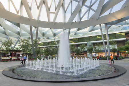 MEXICO CITY, MEXICO - APRIL 20, 2017: Toreo Parque Central shopping center in Mexico City features a huge park setting with a beautiful fountain in the center beneath a modern architecture style glass ceiling.のeditorial素材