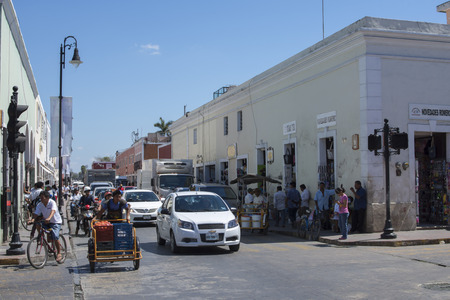 VALLADOLID, YUCATAN, MEXICO - FEBRUARY 24, 2017: The hustle and bustle of morning traffic at a busy intersection is characteristic of the small colonial town of Valladolidのeditorial素材