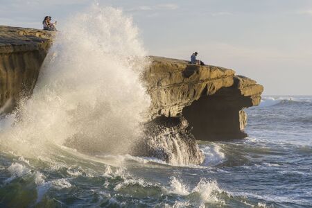 SAN DIEGO, CALIFORNIA, USA - OCTOBER 17, 2017: Sunset Cliffs is a popular destination for romantic couples to watch the sunset as well as the thrilling experience of waves crashing against the cliffsのeditorial素材