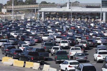TIJUANA, MEXICO - FEBRUARY 8, 2018: Weekday commuters continue to endure long lines at the...