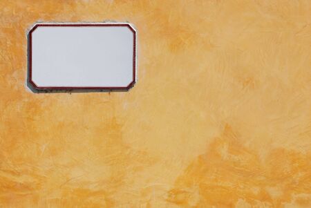 Yellow wall texture background with empty noteの写真素材
