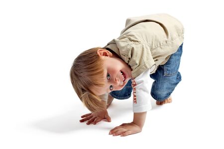 Let's play! Cute 3-years old playful boy isolated on white background.の写真素材