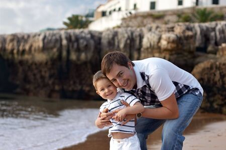 Happy father and son having fun outdoorsの写真素材