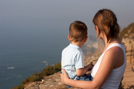 Mother and son enjoying beautiful viewsの写真素材