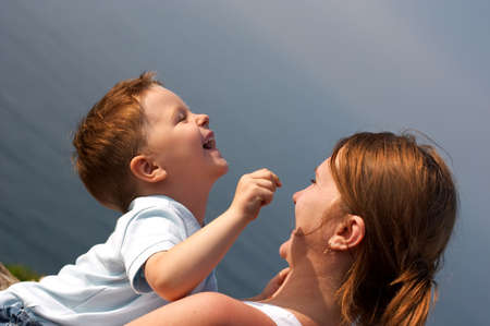 Young mother and son having fun togetherの写真素材