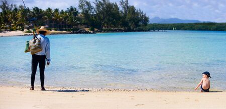 Fisherman and boy. Lifestyle scene from Mauritiusの写真素材