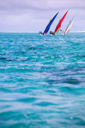 Sailing regatta in Mauritius. Colorful traditional Mauritian wooden boats called Pirogueの写真素材