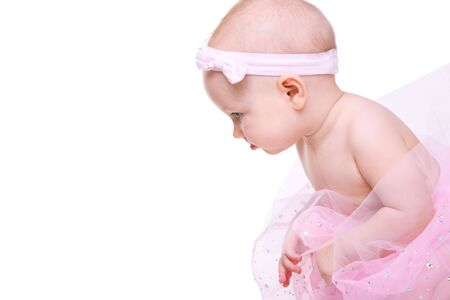 Baby Ballerina. Very cute happy baby girl wearing ballerina skirt. Isolated on white.の写真素材