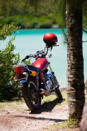 Motorbike parked by the beach