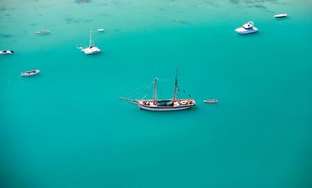 Aerial view of small boats in turquoise waters of Indian ocean 