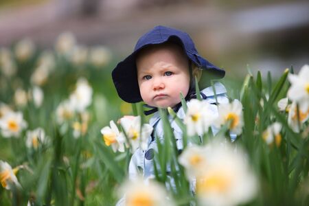 Adorable baby girl portrait outdoors at spring dayの写真素材