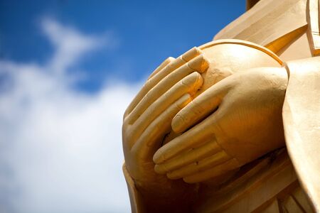 Giant golden Buddha statue hands, Khao Tao in Thailandの写真素材