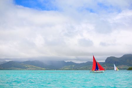 Sailing regatta in Mauritius on colorful traditional wooden boats called "Pirogue".の写真素材