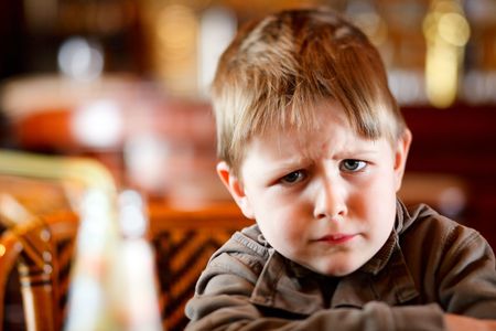 Lifestyle portrait of 4 years old angry boy