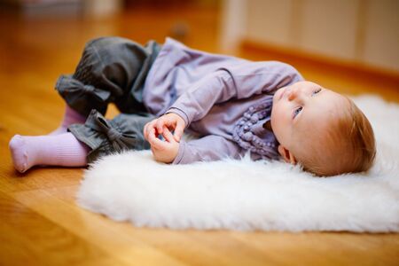 Portrait of adorable 15 months old baby girl in casual clothesの写真素材