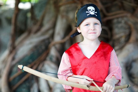 Outdoor portrait of cute boy dressed as pirateの写真素材