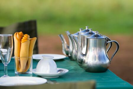 Table set for group breakfast outdoorsの写真素材