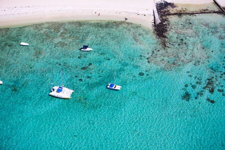 Above view of tropical coast and turquoise ocean in Mauritiusの写真素材