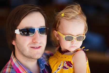 Portrait of young father and his adorable little daughterの写真素材