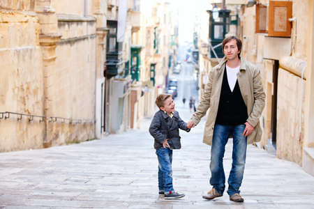 Young father and his son outdoors in cityの写真素材