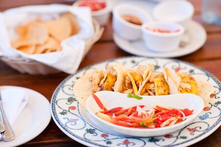 Delicious traditional mexican food tacos, tortillas and saucesの写真素材