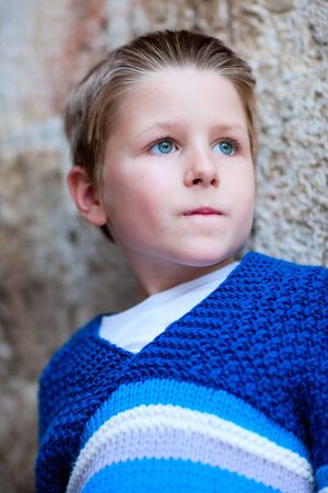 Portrait of cute little boy in sweaterの写真素材