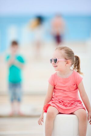 Summer portrait of sweet little girl outdoorsの写真素材