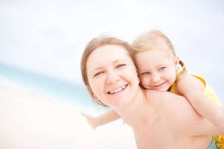 Portrait of mother and daughter having fun outdoors