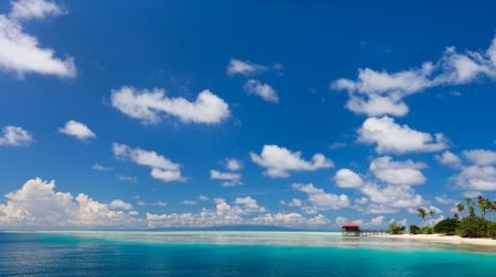 Panorama of idyllic island and turquoise ocean waterの写真素材