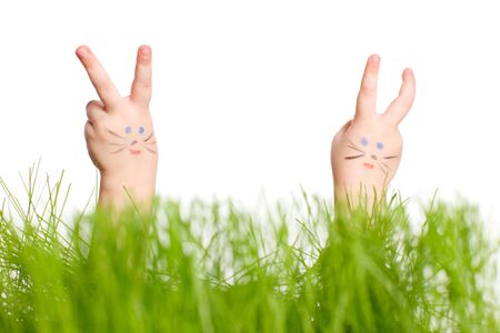 Close up of child hands making Easter bunnies