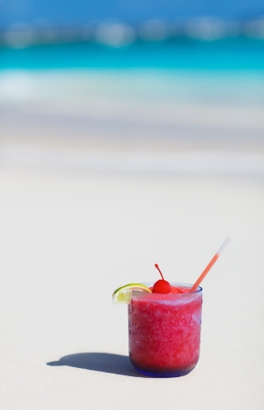 Strawberry daiquiri cocktail on a white sand beachの写真素材