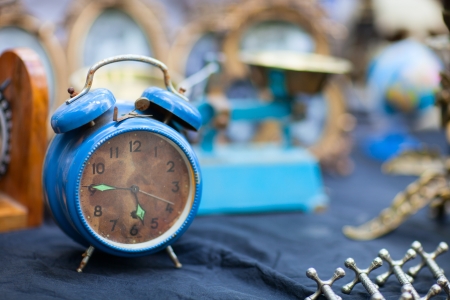 Vintage blue alarm clock at flea marketの写真素材