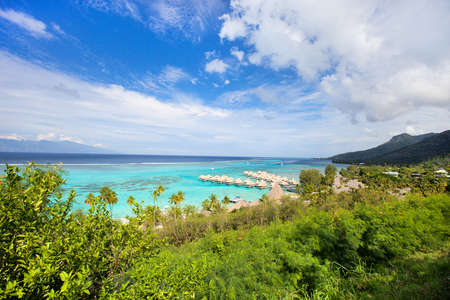 Beautiful coast and over water bungalows at Moorea island in French Polynesiaの写真素材