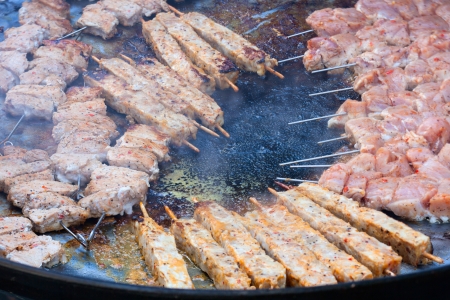 Close up of delicious meat grilling on panの写真素材