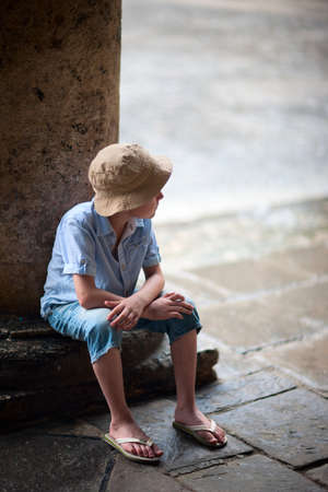 Outdoors portrait of cute boy in a city of old Havanaの写真素材