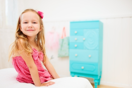 Portrait of adorable little girl in her roomの写真素材