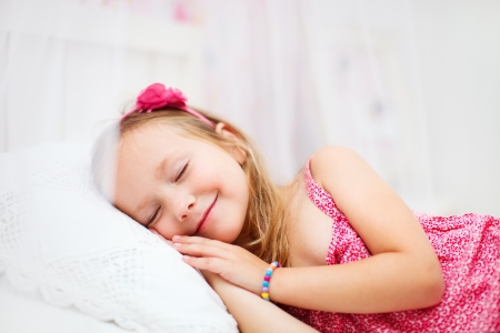 Portrait of adorable little girl in her roomの写真素材