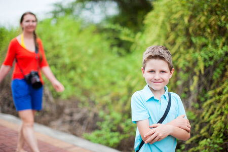 Portrait of mother and son outdoors walkingの写真素材