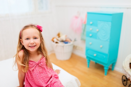 Portrait of adorable little girl in her roomの写真素材