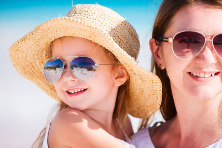 Young mother and her adorable little daughter on summer vacationの写真素材