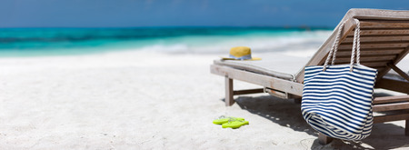 Lounge chairs on a beautiful tropical beach at Maldivesの写真素材
