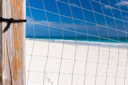 Close up of a volleyball net at tropical beachの写真素材