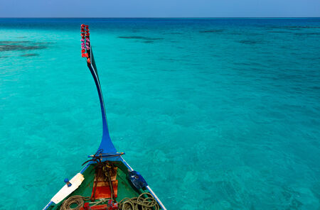 Traditional maldivian boat dhoni in a tropical ocean の写真素材