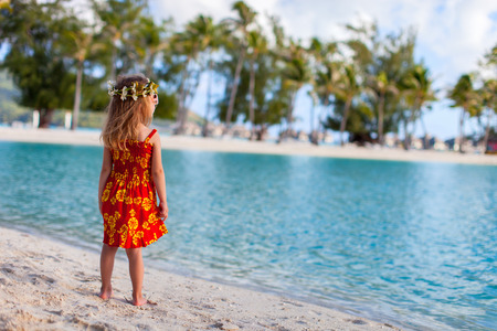 Little girl wearing Polynesian dress at beach on Bora Boraの写真素材