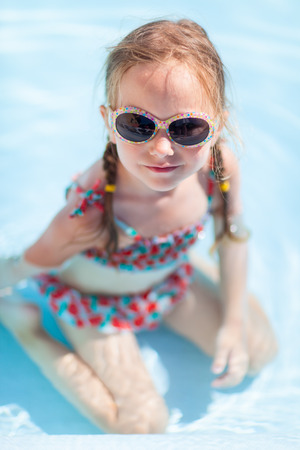 Adorable little girl at swimming poolの写真素材