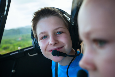 Kids at cabin of helicopter before scenic flightの写真素材