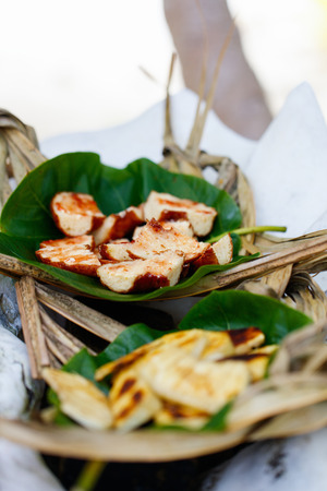 Close up of sweet bread served on weaved platterの写真素材