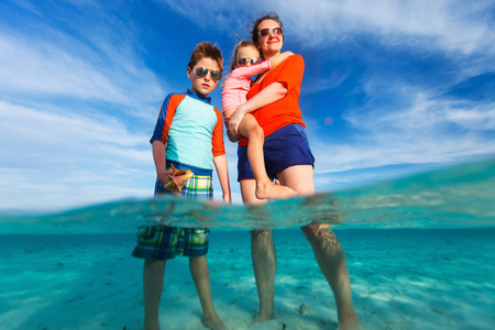 Young mother and her two kids enjoying Caribbean vacationの写真素材